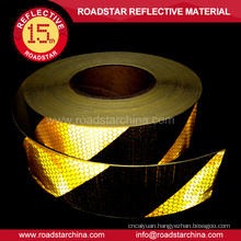 Adhesive retro reflective tape for vehicles